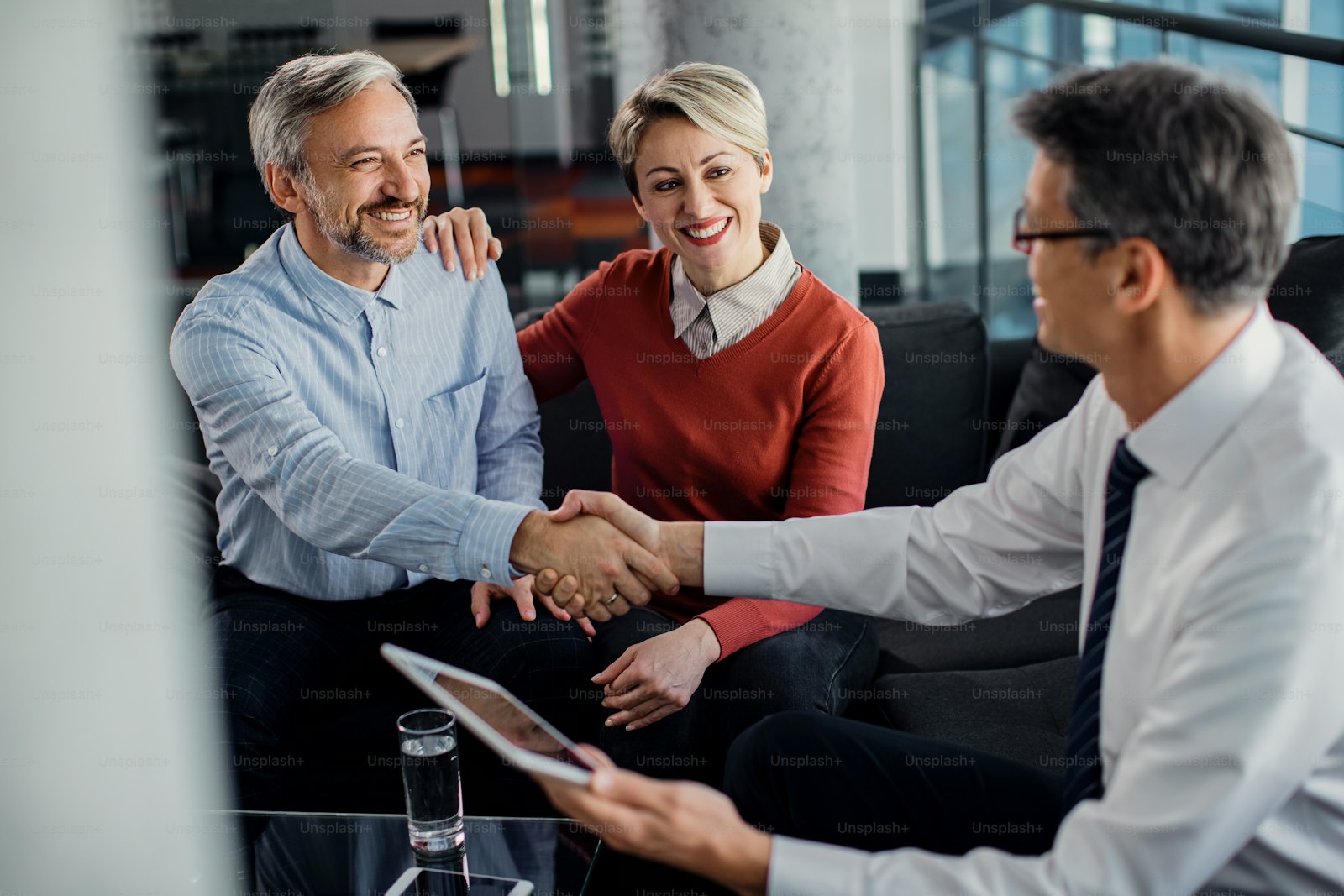 Professional consultant shaking hands with a client in an office