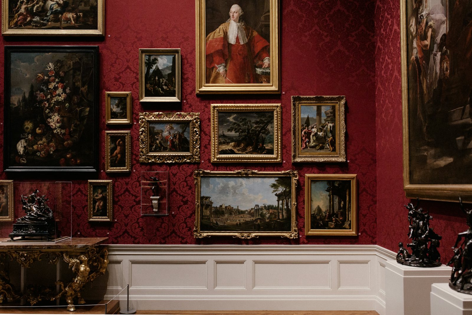 Collector examining fine art and valuables in a gallery setting